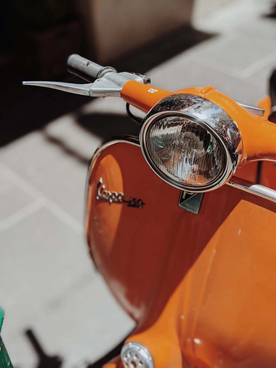 Close-up of an Orange Vespa Scooter